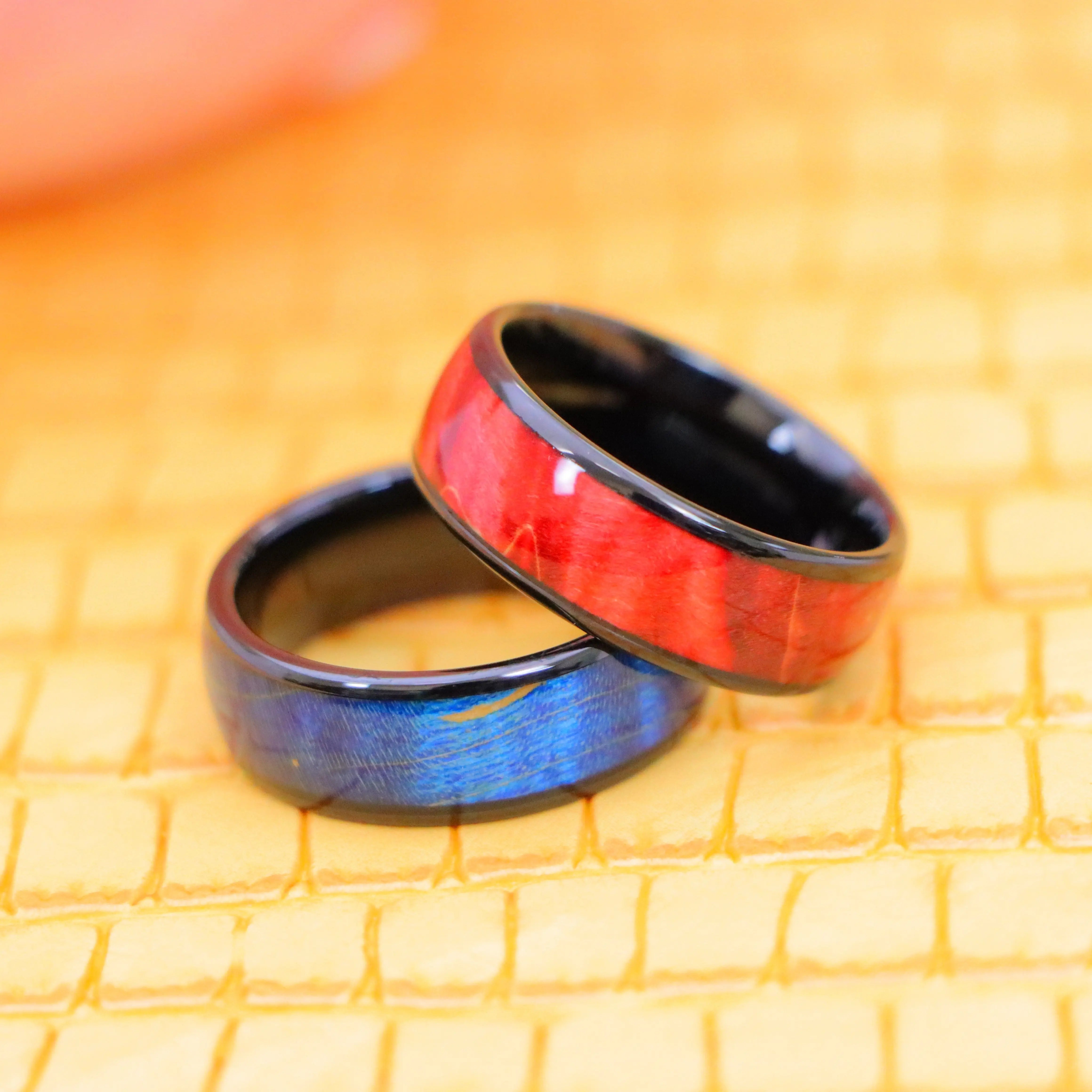 8mm Black IP Domed Azure Stain Stabilized Wood inlay men's tungsten band and 8mm Red Burgundy Hue Solidified Wood Inlay men's Tungsten Ring for Men's Regular wear - one on one spreaded view without tags
