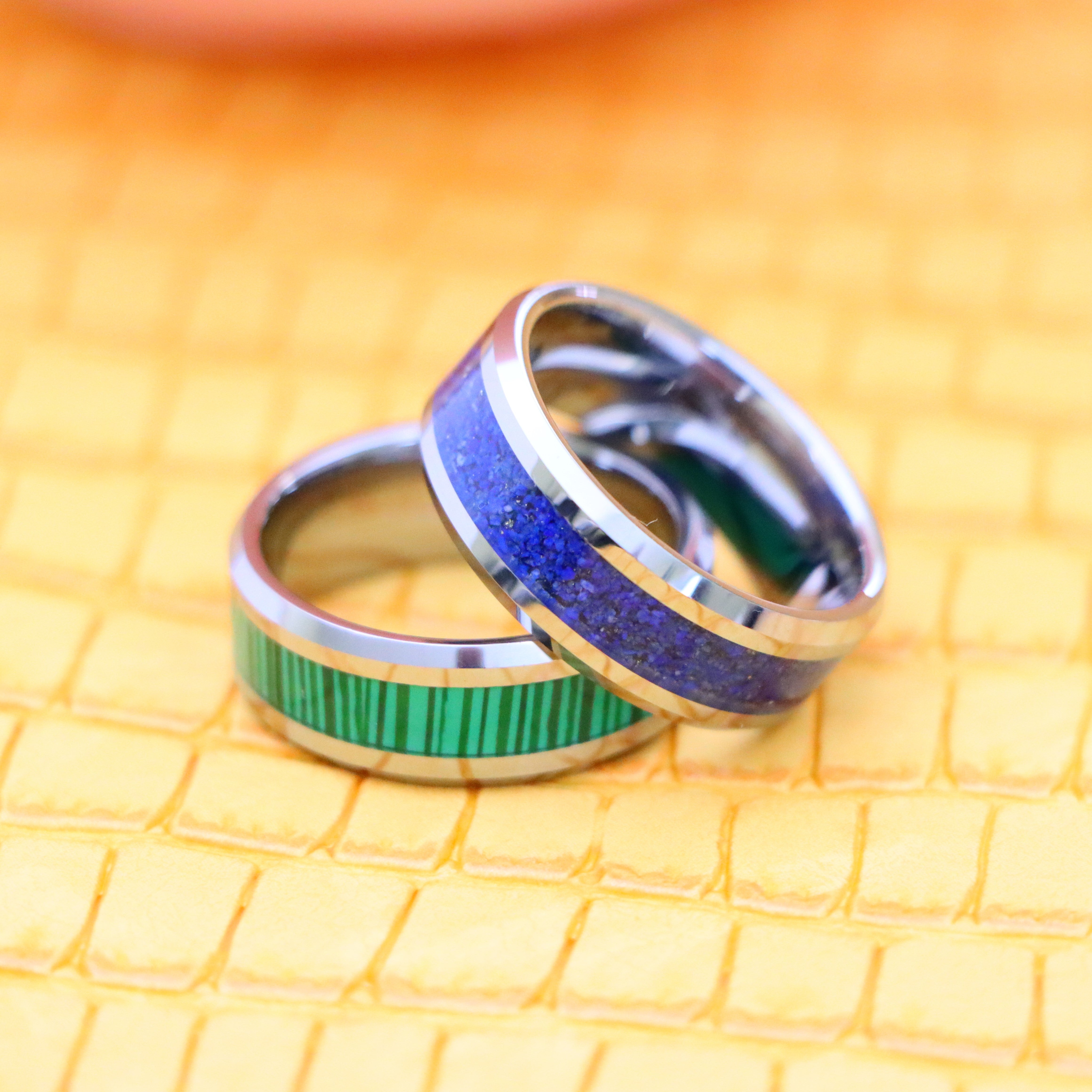 8mm Beveled Edge with Lapis Lazuli good luck tungsten ring and 8mm Beveled Edge with Malachite Strips essence of joy Tungsten Ring - one on one spreaded view