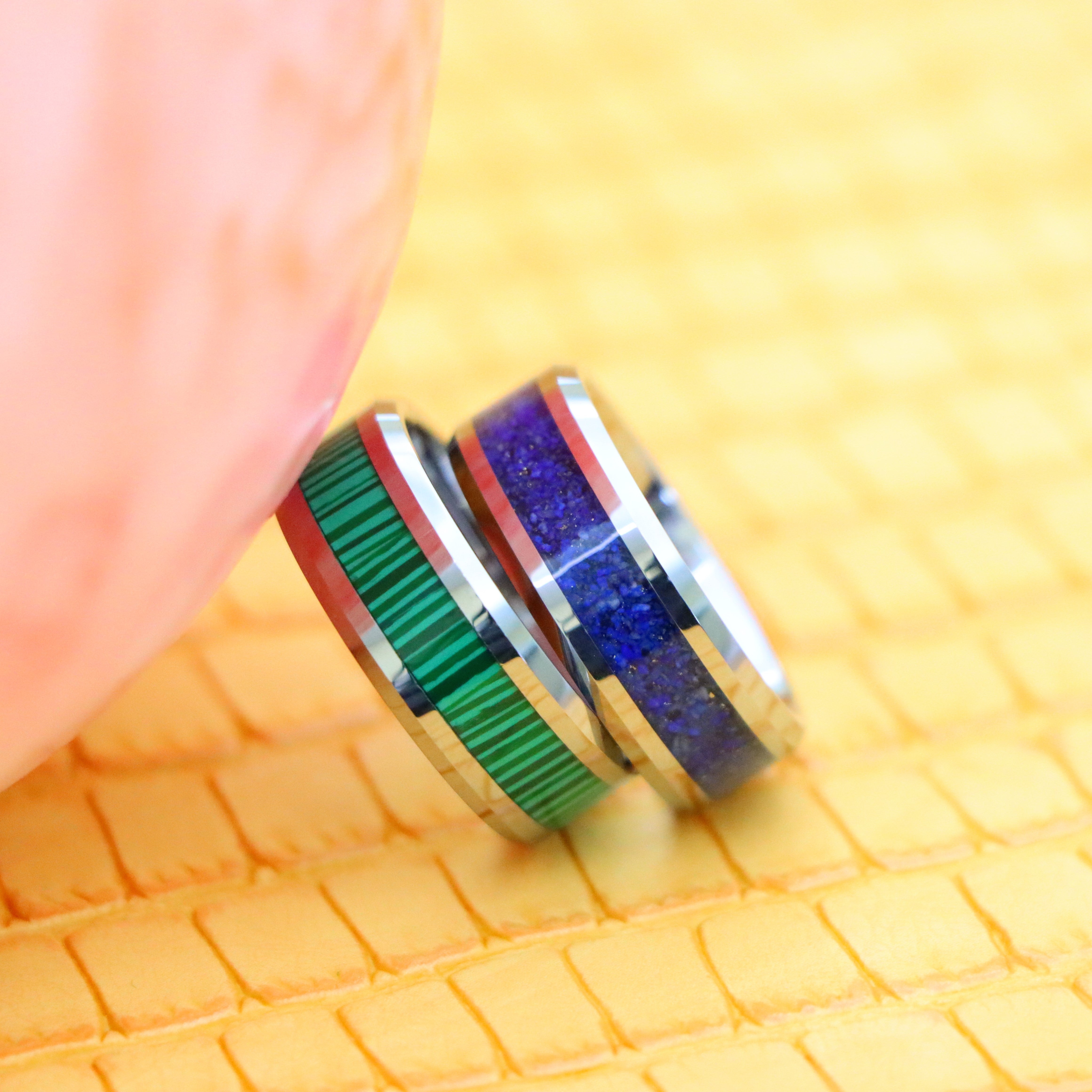 8mm Beveled Edge with Lapis Lazuli good luck tungsten ring and 8mm Beveled Edge with Malachite Strips essence of joy Tungsten Ring - Falling one on one front view