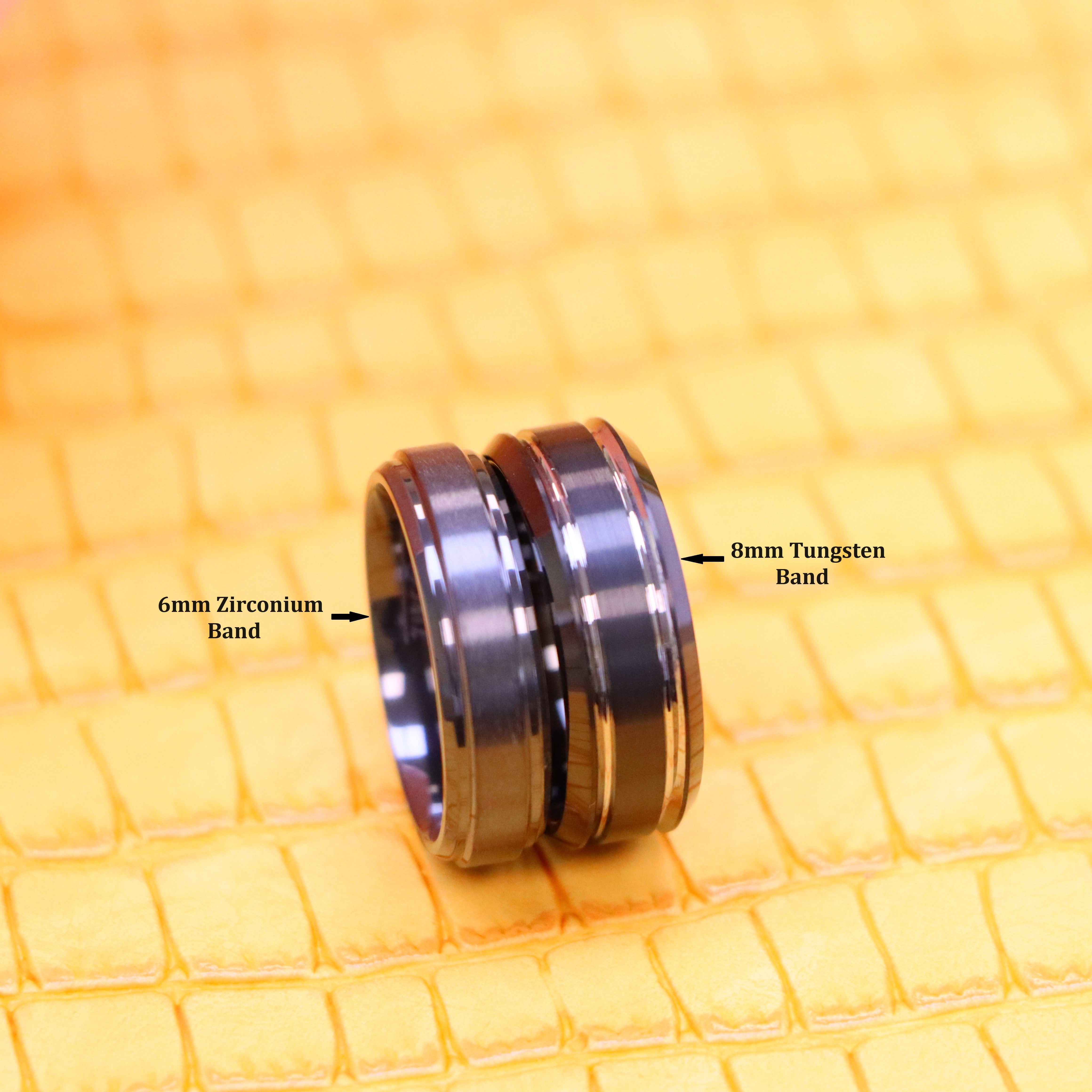Two-tone Black color gunmetal ring. one 8mm Tungsten band with silver edge stripes on the right side and 6mm Zirconium band on the left side