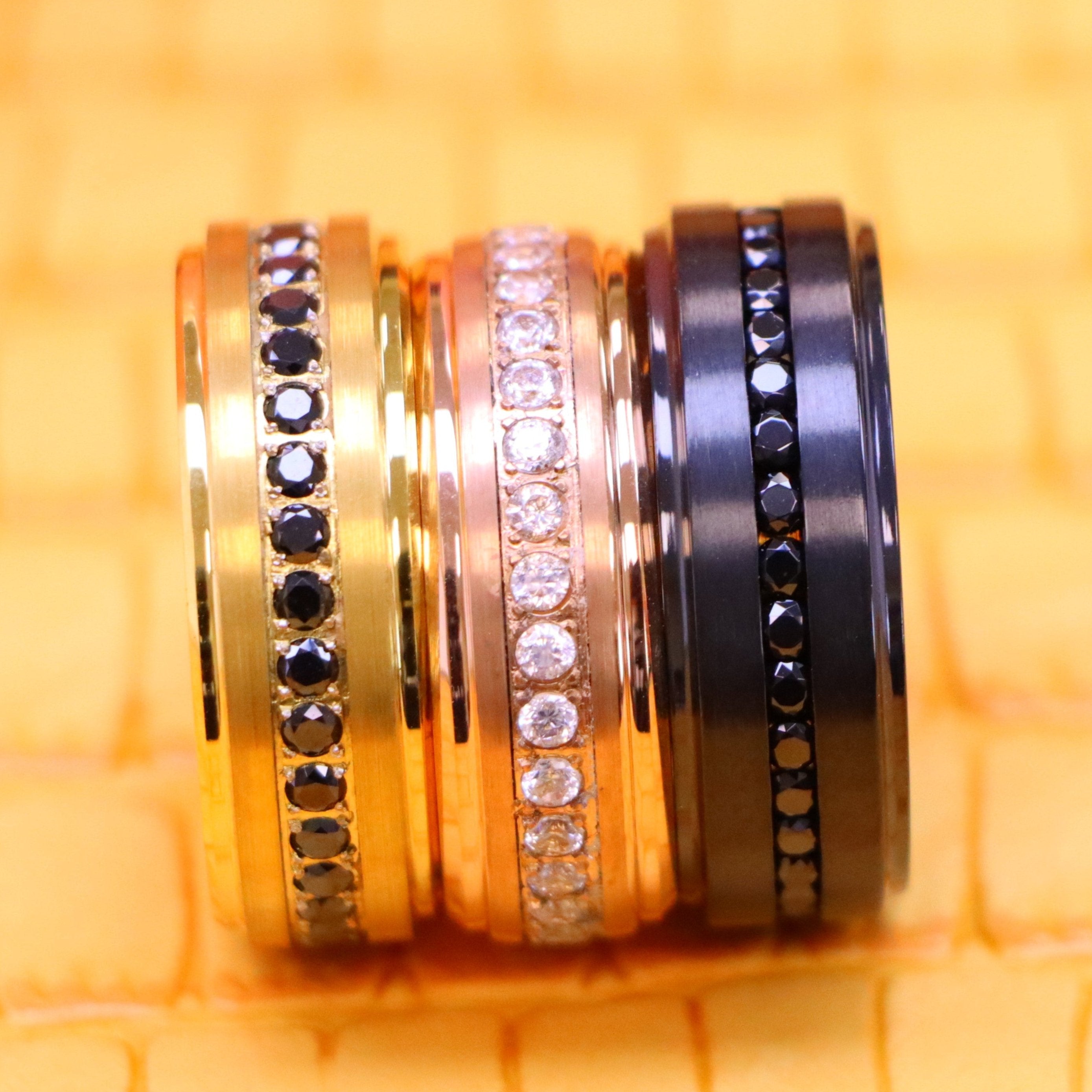 8mm Black IP Plated Titanium Beveled Edge Black CZ Eternity Band, Rose Gold IP Plated White CZ Round Cut Eternity Tungsten Ring and Yellow Gold IP Plated White CZ Round Cut Eternity wedding Tungsten Ring for men - clear front view