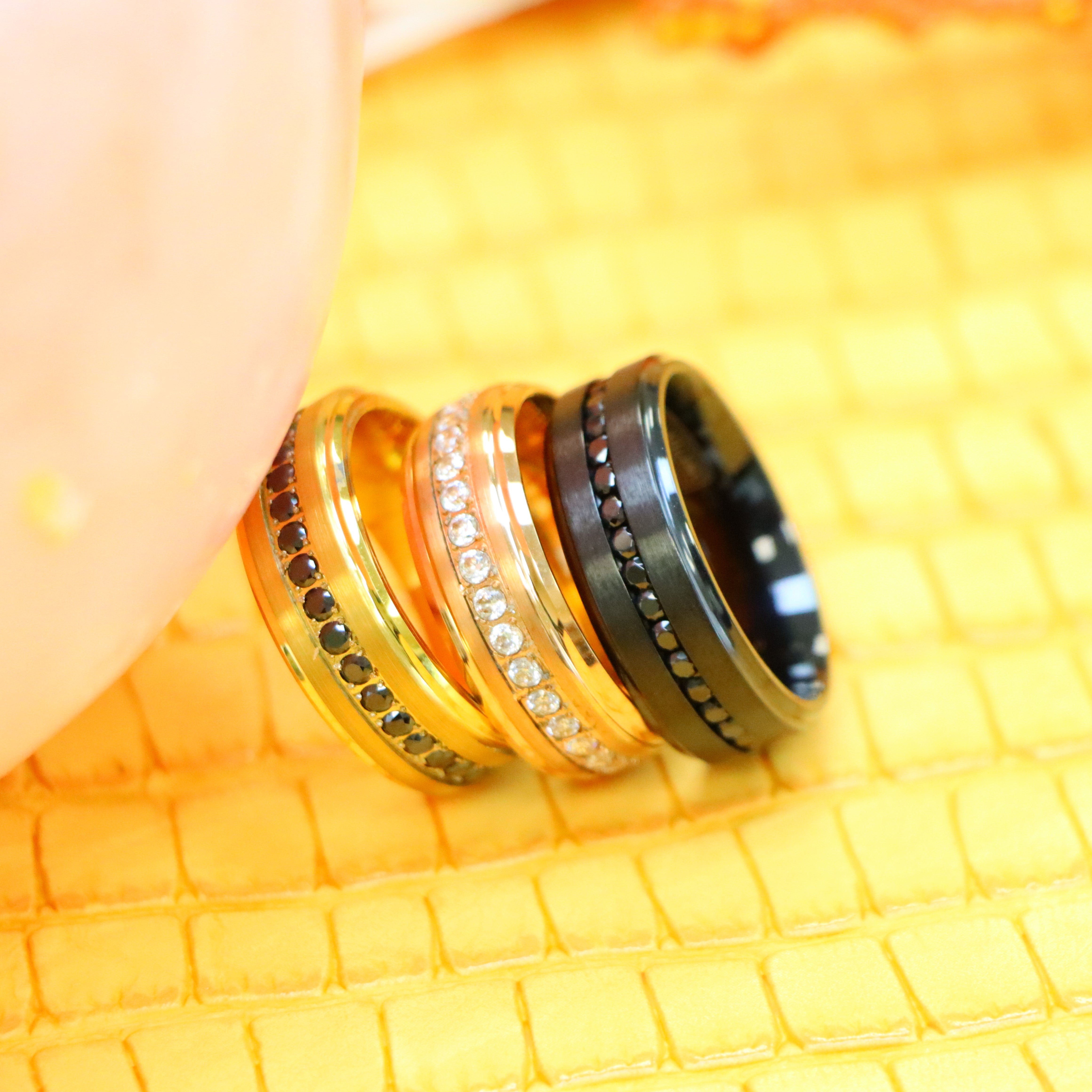 8mm Black IP Plated Titanium Beveled Edge Black CZ Eternity Band, Rose Gold IP Plated White CZ Round Cut Eternity Tungsten Ring and Yellow Gold IP Plated White CZ Round Cut Eternity wedding Tungsten Ring for men - clear side view