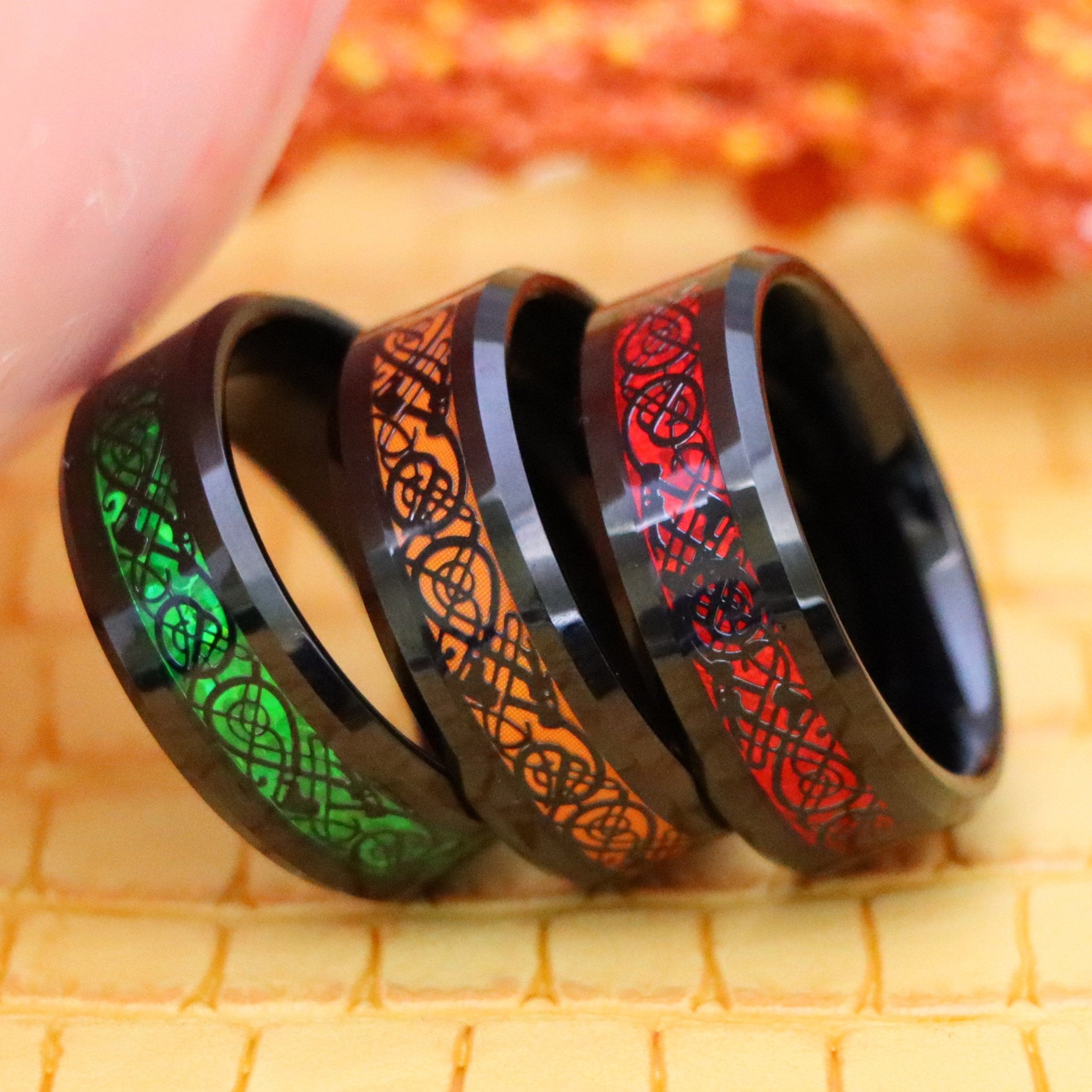 8mm Black & Red, Black & Green, Black & Orange Celtic Inlay cycle of life Tungsten Ring for men and women who believe in interconnectedness - one on one falling front view