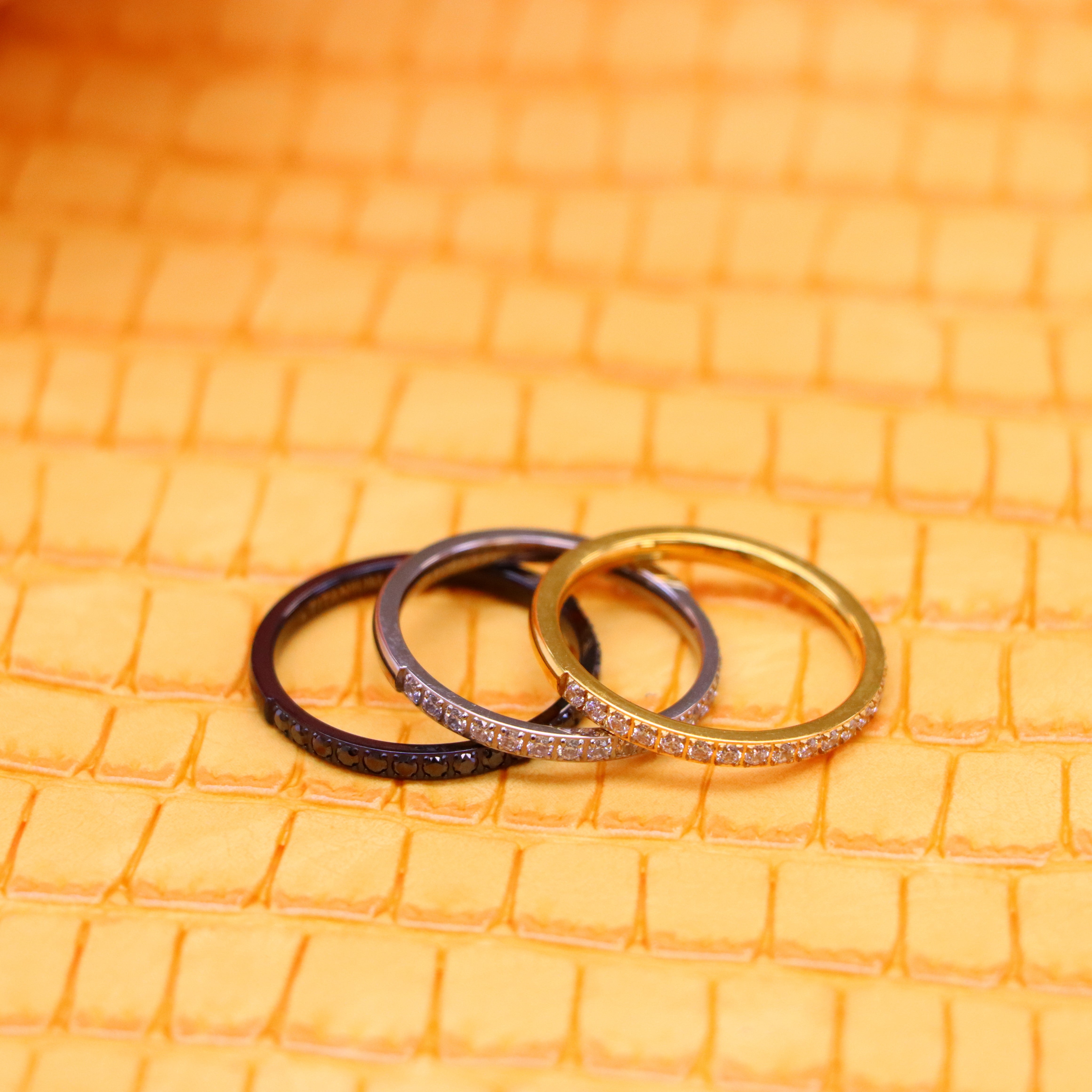 2mm Yellow, Black, Silver Titanium Half Eternity Titanium Ring with White cz stones on yellow and silver titanium rings and black CZ Stones on black titanium ring spreaded one on one side view