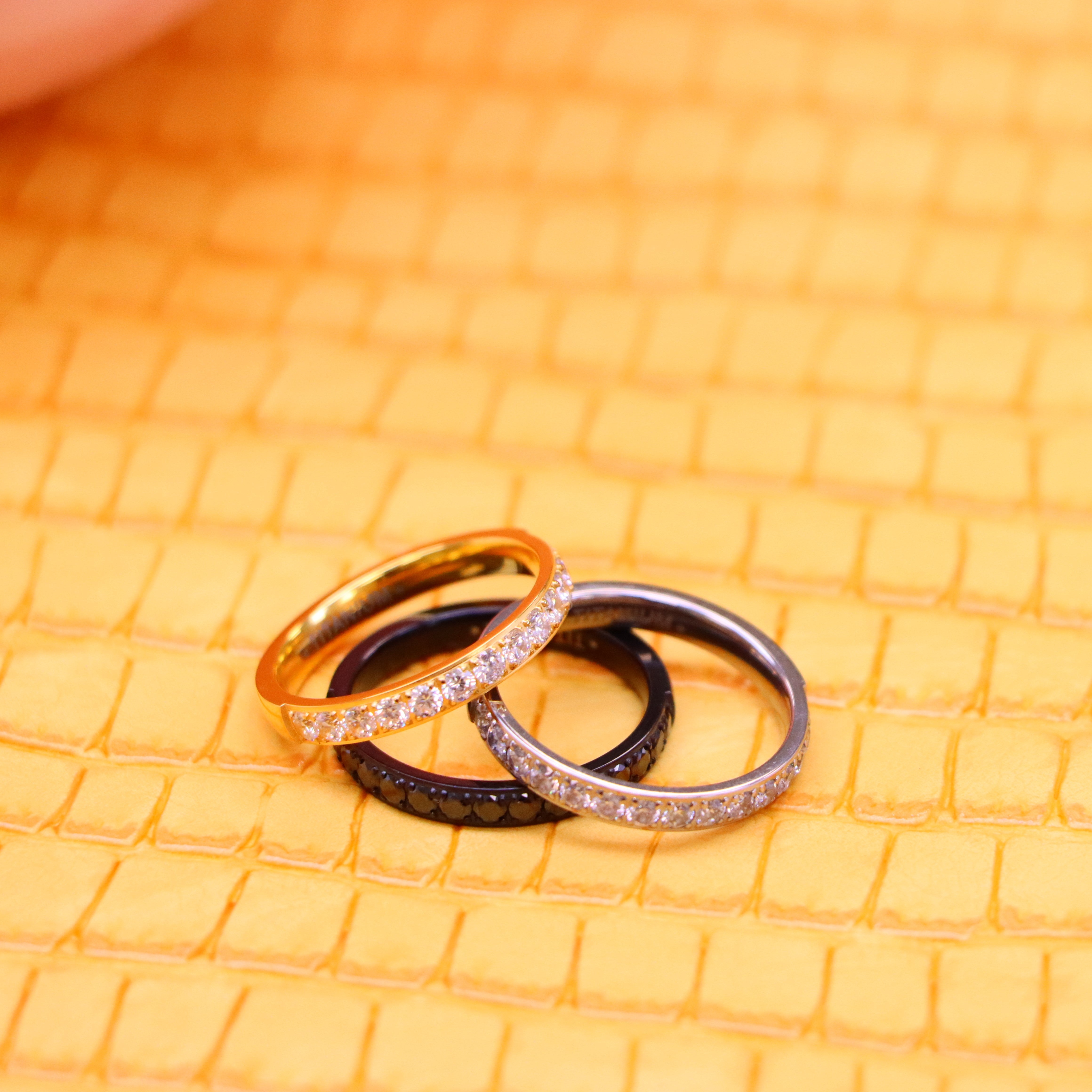 Highly recommended men's 3mm Titanium and yellow IP Plated Half Eternity black CZ ring and 3mm black IP Plated Half Eternity black CZ ring one on one stack view